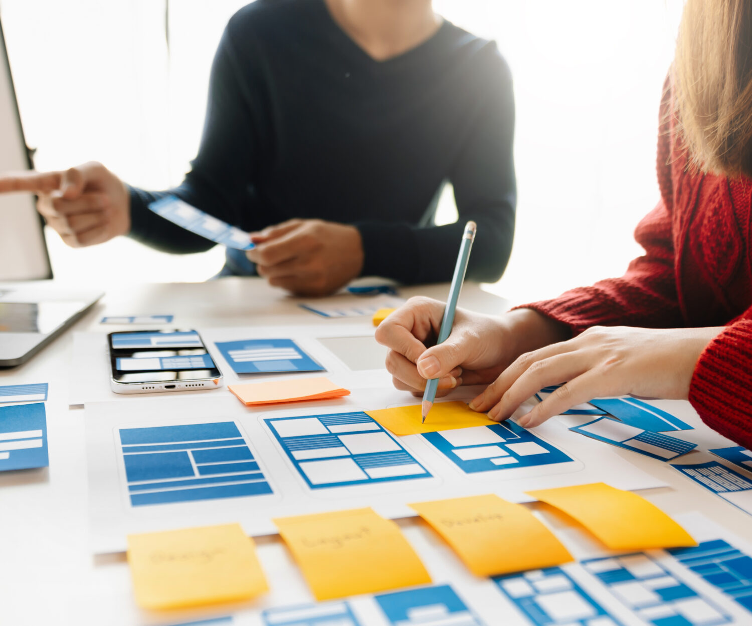 UX graphic designer planning application process development prototype wireframe for web smart phone. Creative digital development agency. at office