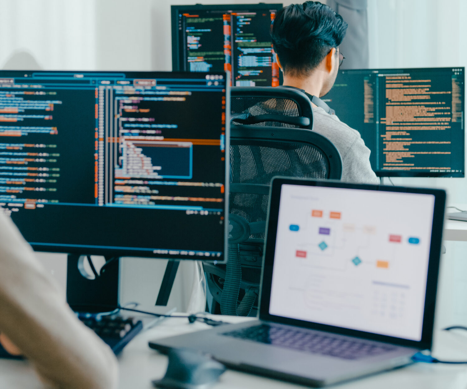 Closeup Adult Asia male, female freelance typing write prompt AI bot IT app smart program nomad, video game, terminal with coding language, user interface, designer, big data center desktop computer.